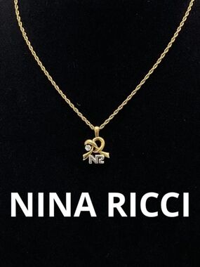Nina Ricci Gold-Tone Ribbon 'NR' Pendant Necklace w/ Crystal Accent
